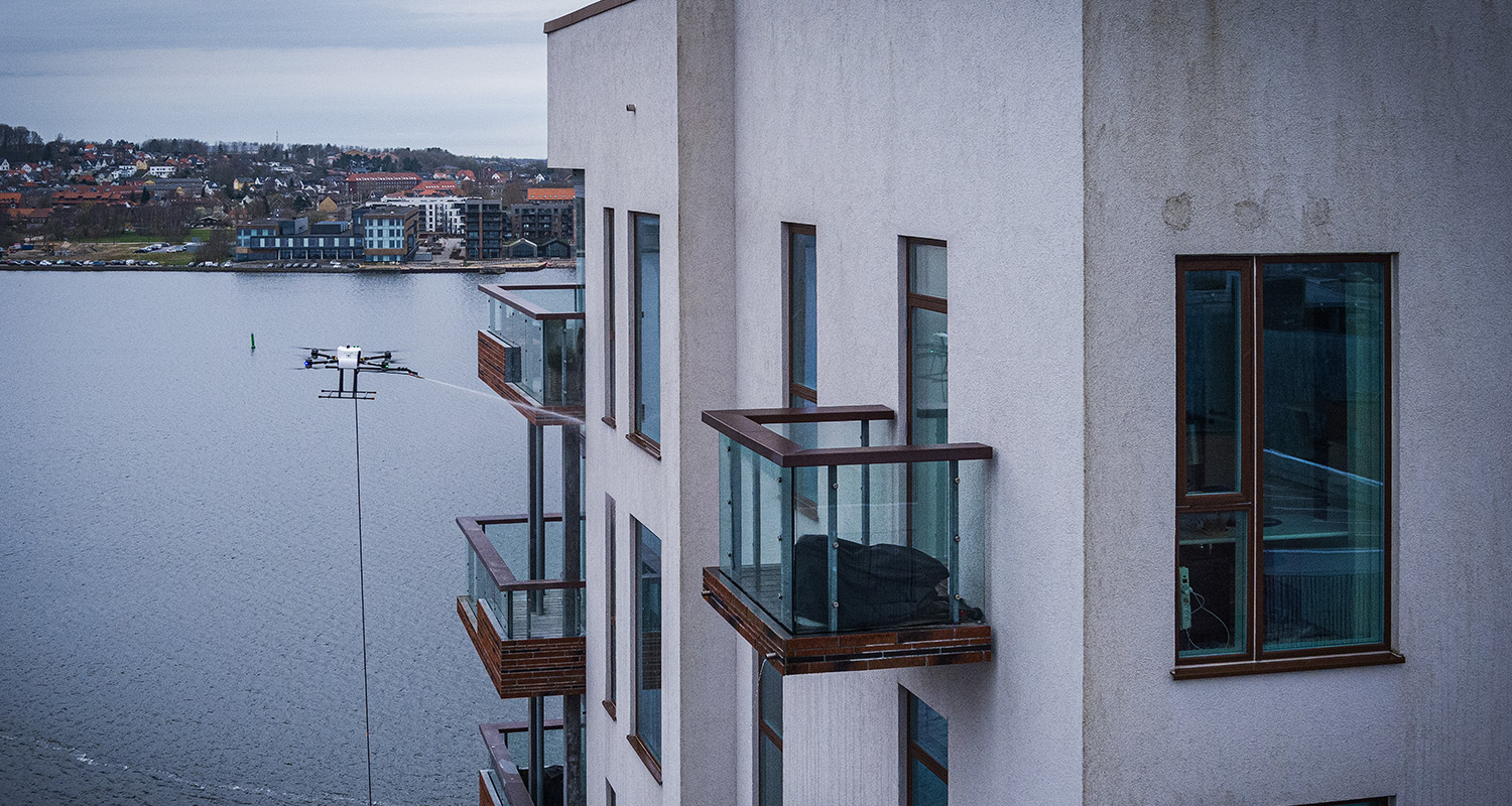 High-DRA renser højhusfacade over fjorden i Aalborg